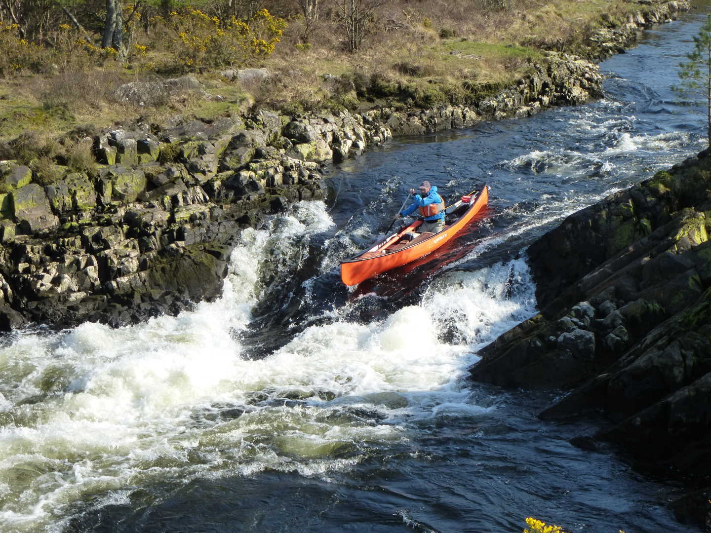 Simon kayaking down a rapid