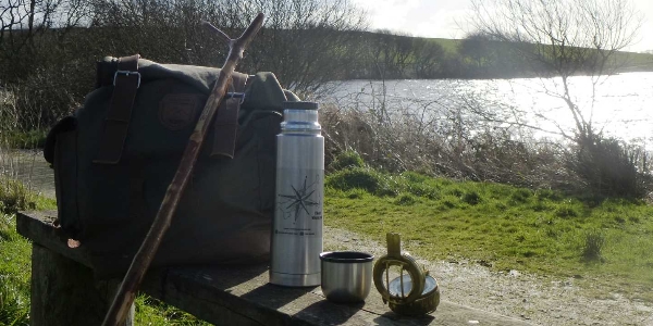 A view of Simon's walking gear on a bench, with the river in the background